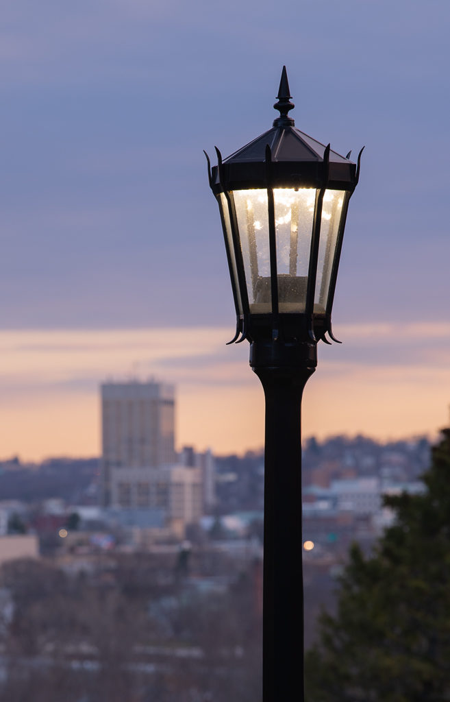 Outdoor light post in front of Worcester skyline